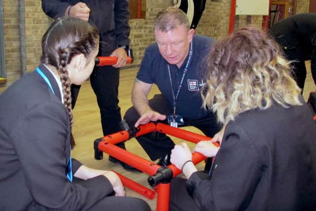 CPO Brian Bell (centre) talking through one of the practical problems