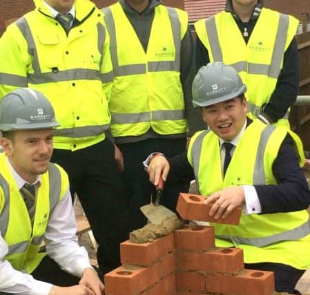 Alan Mak (front right) poses with Barratt Homes apprentices, who will be at the event