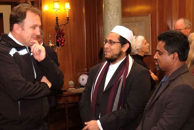 Portsmouth chief inspector Jim Pegler with Muhammad Uddin, imam of Jami Mosque, and Saliqur Rahman, mosque secretary, at the 20th anniversary celebrations of Portsmouth Mediation Service