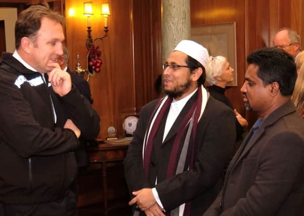 Portsmouth chief inspector Jim Pegler with Muhammad Uddin, imam of Jami Mosque, and Saliqur Rahman, mosque secretary, at the 20th anniversary celebrations of Portsmouth Mediation Service