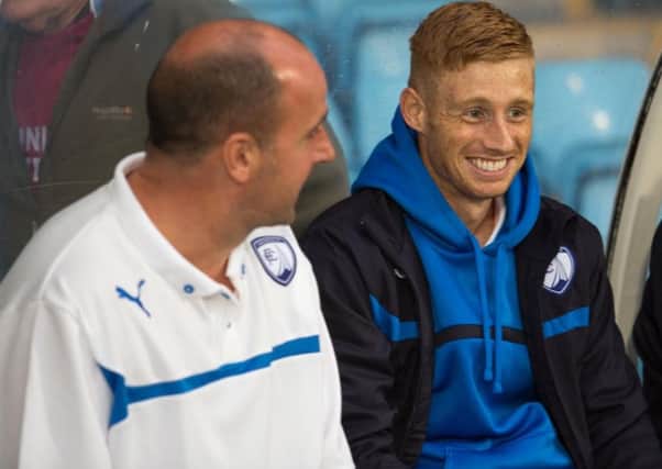 Eoin Doyle, right, has reunited with Pompey boss Paul Cook