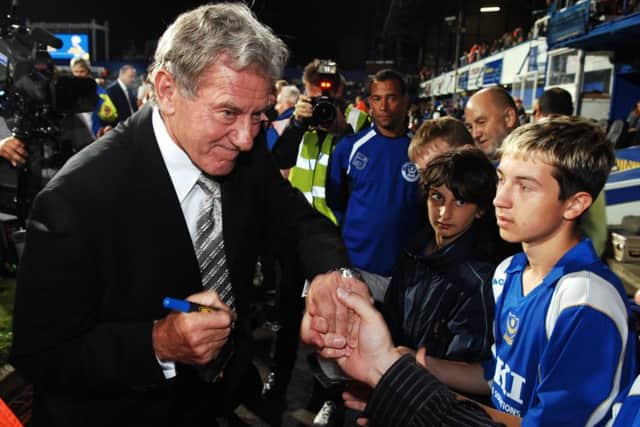 Milan Mandaric signs autographs