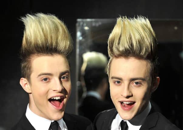 This undated handout photo released by  Channel 5 and taken in an unknown location shows Jedward - John and Edward Grimes,   contestants in the 'Celebrity - Big Brother 2011' which commences at Elstree Studios, in London, Thursday, Aug 18, 2011. (AP Photo / Channel 5, Jon Cogill) EDITORIAL USE ONLY ENGSUS00320130923093053