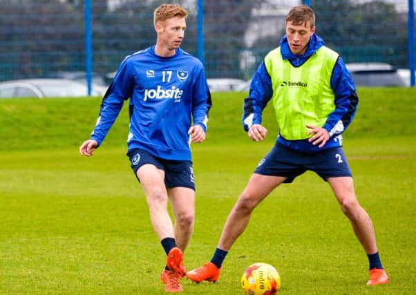 New Pompey striker Eoin Doyle, left, with Tom Davies in training Picture: Colin Farmery