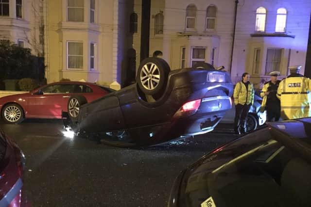 Overturned car in Campbell Road, Southsea. Picture by Michael Kerridge