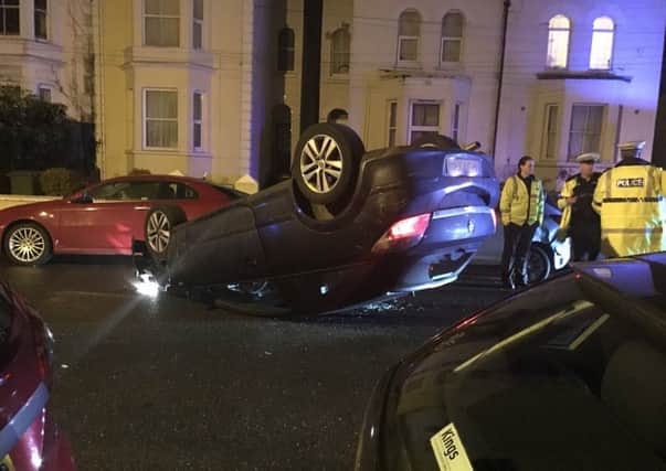 Overturned car in Campbell Road, Southsea. Picture by Michael Kerridge