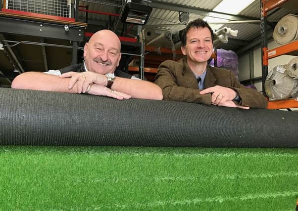 Portsmouth Flooring owner Alan Cobb, left, with Russell Mogridge of commercial property consultancy Hughes Ellard at Portsmouth Floorings new trade counter in Portsmouth
