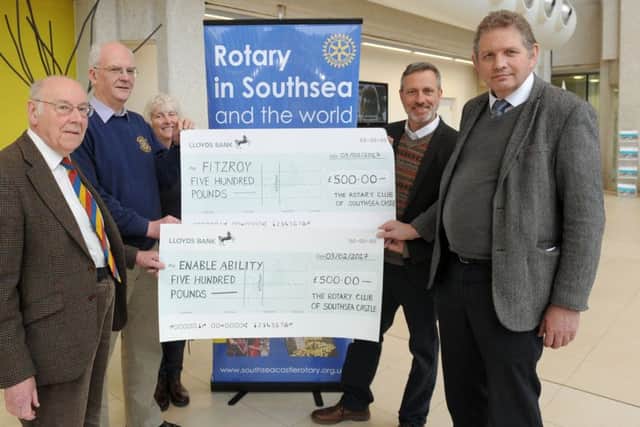 The Dragon Boat Festival Committee presented two Â£500 cheques for charities Enable Ability and Fitzroy at 1000 Lakeside on Friday.Pictured is: (l-r) David Collins, president of Portsmouth and Southsea Rotary Club, Ken Ebbens, president of Southsea Castle Rotary Club, Carol Jenkinson, committee member, Jim Apted, community and fundraising co-ordinator for Fitzroy and Richard Soutar, charity manager at Enable Ability. Picture: Sarah Standing (170177-2282)