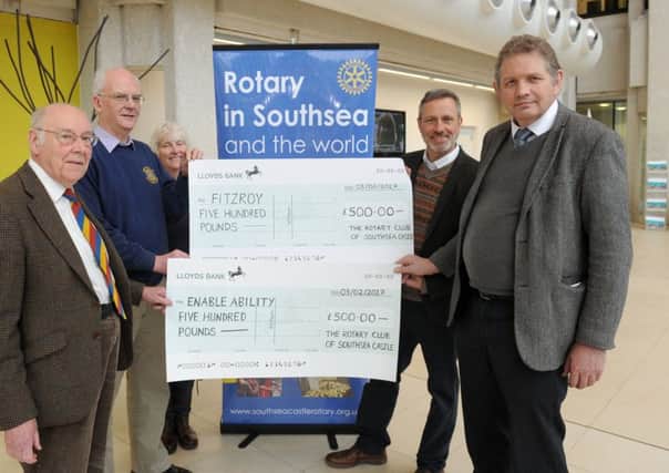 The Dragon Boat Festival Committee presented two Â£500 cheques for charities Enable Ability and Fitzroy at 1000 Lakeside on Friday.

Pictured is: (l-r) David Collins, president of Portsmouth and Southsea Rotary Club, Ken Ebbens, president of Southsea Castle Rotary Club, Carol Jenkinson, committee member, Jim Apted, community and fundraising co-ordinator for Fitzroy and Richard Soutar, charity manager at Enable Ability. 

Picture: Sarah Standing (170177-2282)