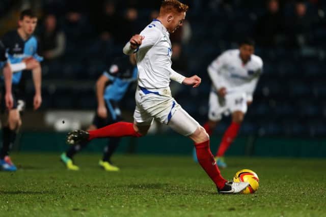 Ryan Taylor scores from the penalty spot against Wycombe in January 2014 Picture: Joe Pepler