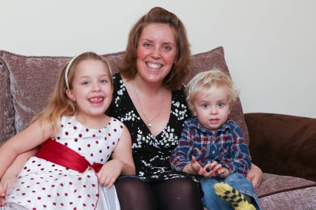 Kim Bradshaw with her children, Olivia, seven, and Eli, two.  Picture: Habibur Rahman