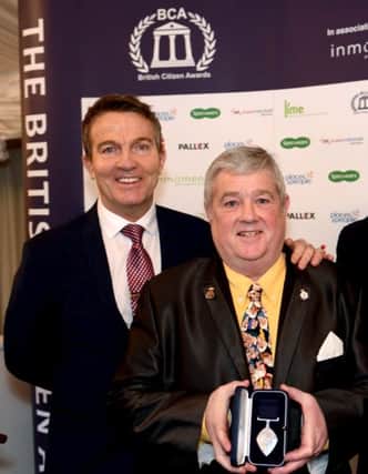 Les Heyhoe (right) poses with TV presenter Bradley Walsh (left) after being awarded with his BCAv at the British Citizen Awards in London.
