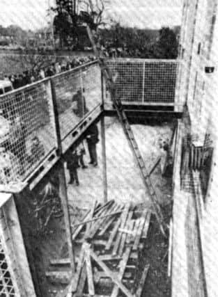 Looking down through the  floor of the collapsed balcony.