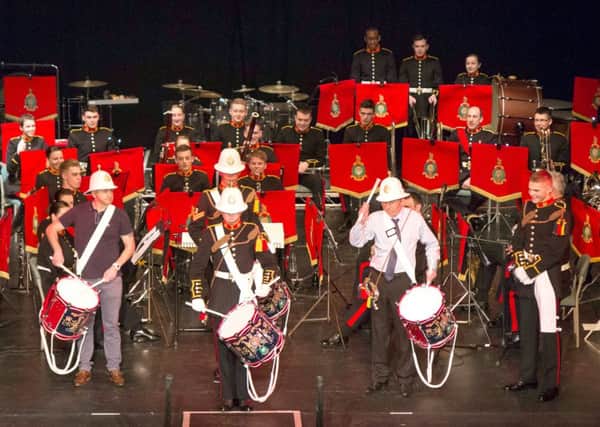 Children from Medina Primary School Portsmouth with musicians from the Royal Marines School of Music