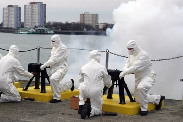 A 21-gun salute was fired by the Royal Navy in Portsmouth to mark the 65th anniversary of the Queens ascension to the throne