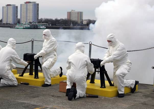 A 21-gun salute was fired by the Royal Navy in Portsmouth to mark the 65th anniversary of the Queens ascension to the throne