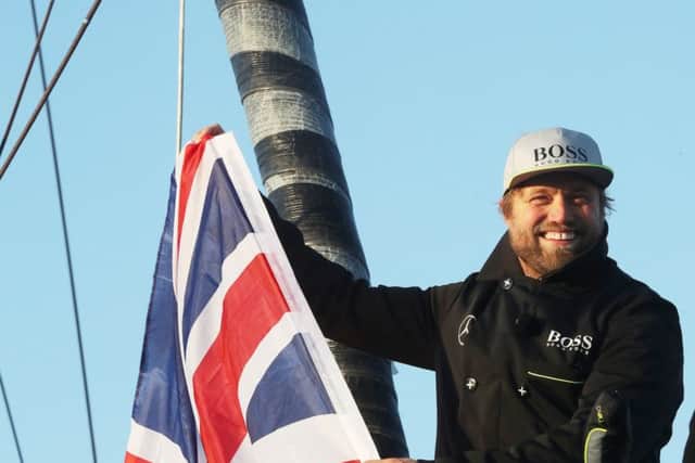 Alex Thomson celebrates finishing the Vendee Globe Picture: Lloyd Images