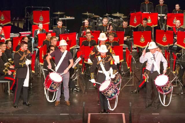 Members of the Royal Marines School of Music entertain crowds