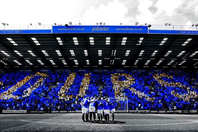 The famous OURS picture taken of the Fratton End ahead of the game against Oxford on the opening day of the 2013-14 season Picture: Joe Pepler