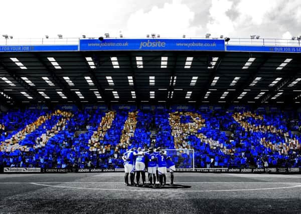 The famous OURS picture taken of the Fratton End ahead of the game against Oxford on the opening day of the 2013-14 season Picture: Joe Pepler