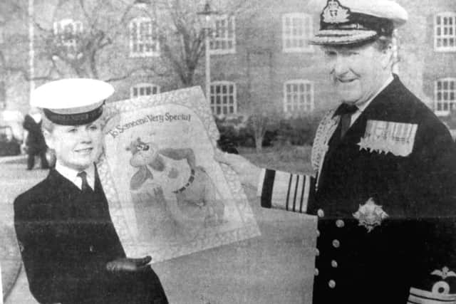 Admiral Sir Desmond Cassidi is presented with a giant Valentines card, by wren Yvonne McClure