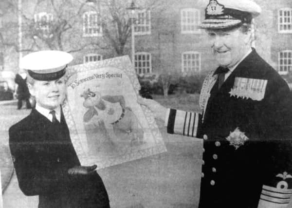 Admiral Sir Desmond Cassidi is presented with a giant Valentines card, by wren Yvonne McClure