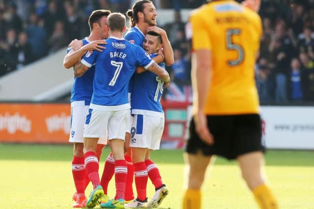 Conor Chaplin is congratulated for his goal against Cambridge at the Abbey Stadium earlier in the season, with his strike proving the difference as Pompey recorded a 1-0 win