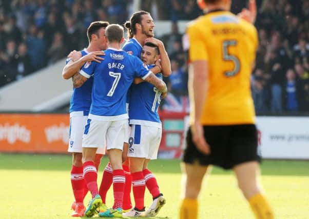 Conor Chaplin is congratulated for his goal against Cambridge at the Abbey Stadium earlier in the season, with his strike proving the difference as Pompey recorded a 1-0 win