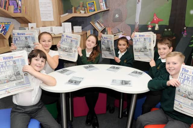 Pupils from Langstone Junior School in Portsmouth, are taking part in The News Lets Read Challenge. From left, Oscar Burns, Heidi Giles, Emine Ulucan, Anais Barley, Jack Wicken and Jayden Harper 						      Picture: Sarah Standing (170190-6685)