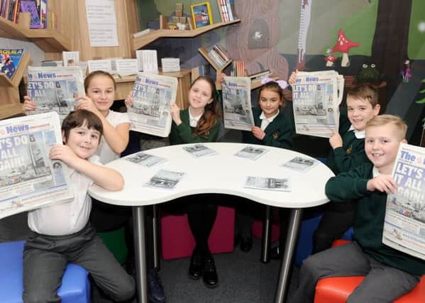 Pupils from Langstone Junior School in Portsmouth, are taking part in The News Lets Read Challenge. From left, Oscar Burns, Heidi Giles, Emine Ulucan, Anais Barley, Jack Wicken and Jayden Harper 						      Picture: Sarah Standing (170190-6685)