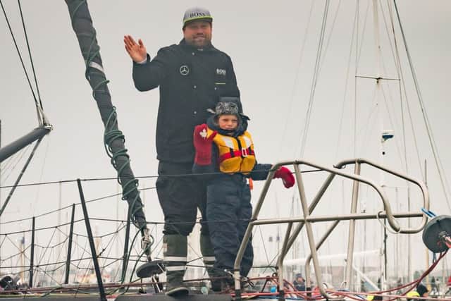Alex Thomson coming back into Gosport with his son Oscar Picture: Keith Woodland (170197-007)