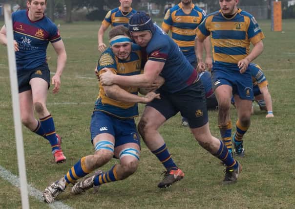 Gosport & Fareham's Rhys Bingham is dragged into touch. Picture: Keith Woodland (170198-187)