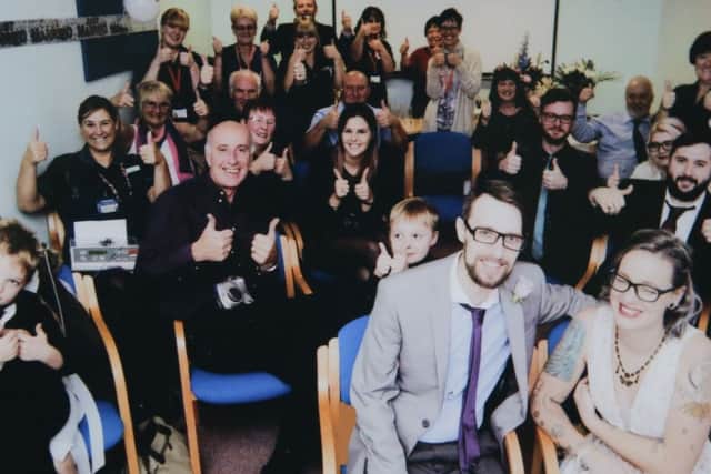 Mark and Kelly Robson on their wedding day with friends, family and nurses at QA Hospital