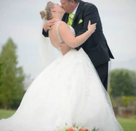 Jason & Josie Johnsey share a matrimonial kiss. Picture: Mark Robbins Photography