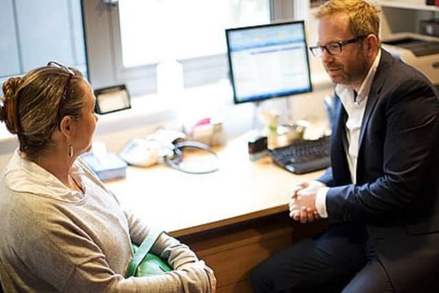 A patient talks to a GP Picture posed by models