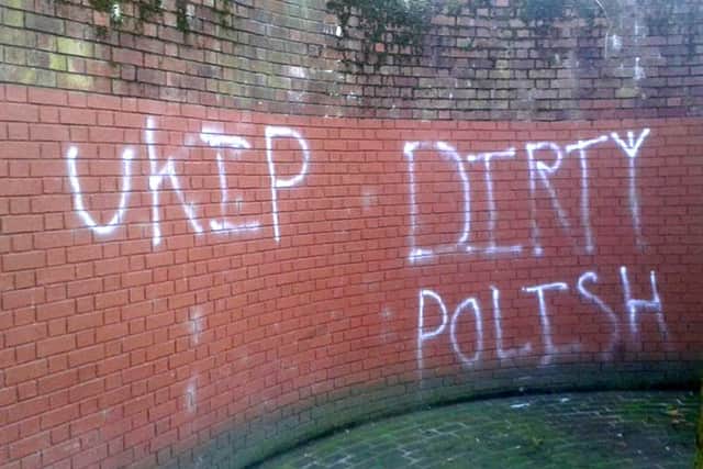 Racist graffiti spray-painted on the wall near the war memorial at Guildhall Square in Portsmouth after the referendum result