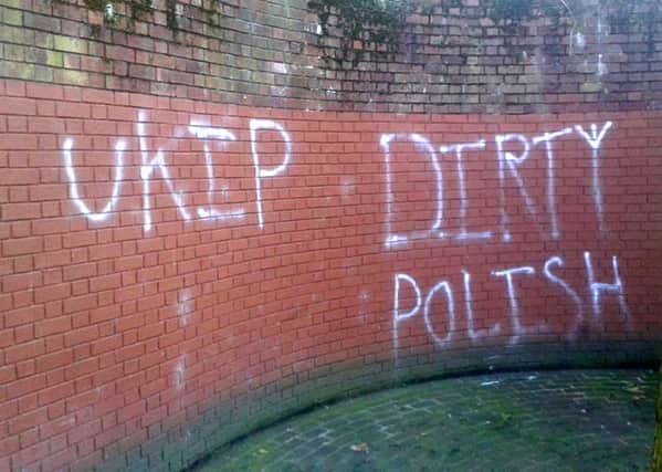 Racist graffiti spray-painted on the wall near the war memorial at Guildhall Square in Portsmouth after the referendum result