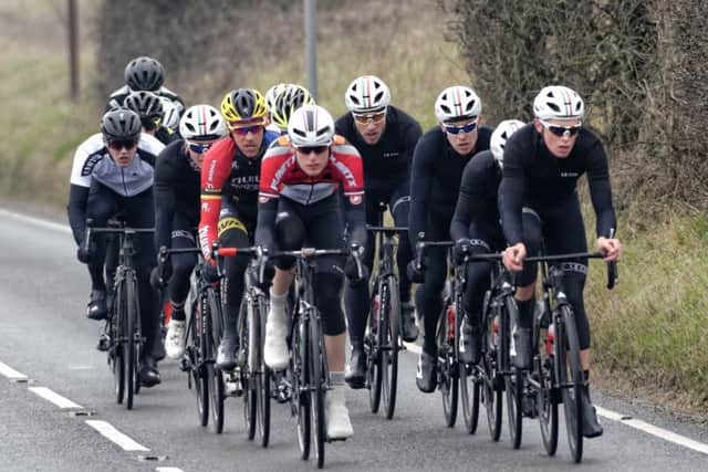 Jack Billyard, left, and Rory Townsend, right, lead the front group towards the summit of Portsdown Hill. Picture: Neil Marshall (170101-02)