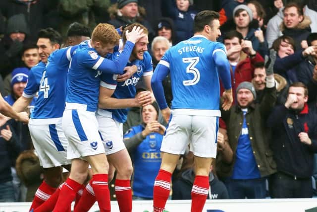 The Pompey players and fans alike celebrate Matt Clarkes opener against Accrington on Saturday after 75 seconds Picture: Joe Pepler