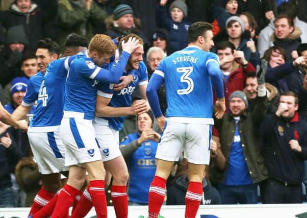 The Pompey players and fans alike celebrate Matt Clarkes opener against Accrington on Saturday after 75 seconds Picture: Joe Pepler