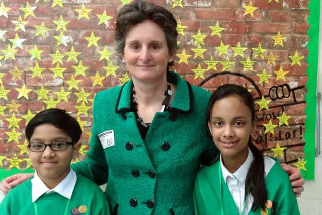 Portsmouth South MP Flick Drummond with head boy Sajid Ali and head girl Tasmin Nessa