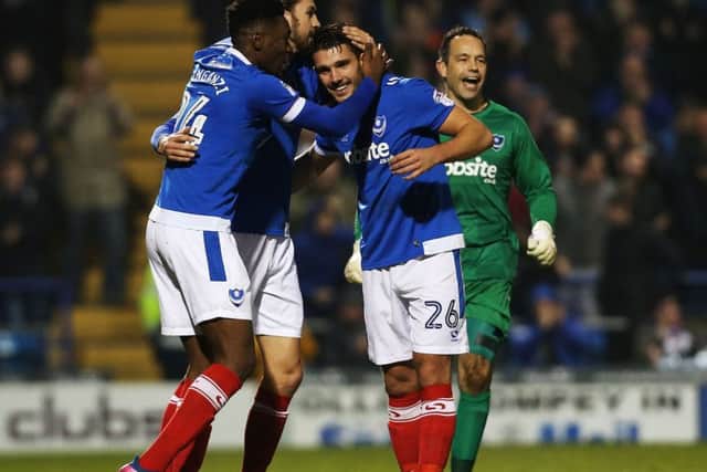 Gareth Evans celebrates his goal with Amine Linganzi and Christian Burgess Picture: Joe Pepler