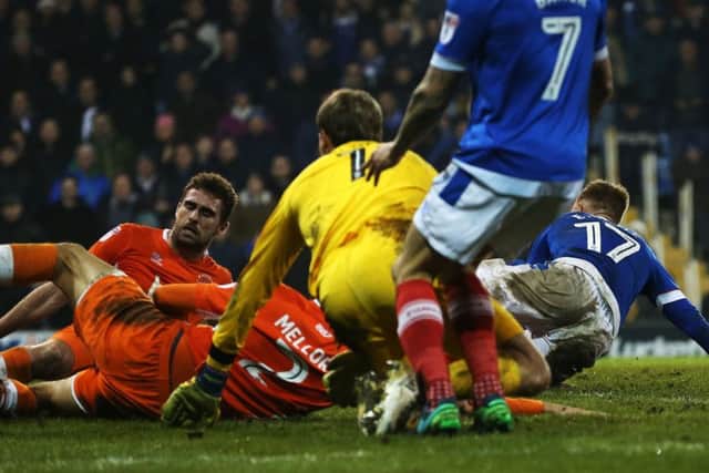 Eoin Doyle, right, slides home Pompey's second goal - his first for the club - late on in the Blues' 2-0 win over Blackpool Picture: Joe Pepler