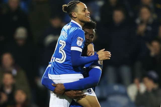 Kyle Bennett celebrates with Amine Linganzi at the final whistle Picture: Joe Pepler