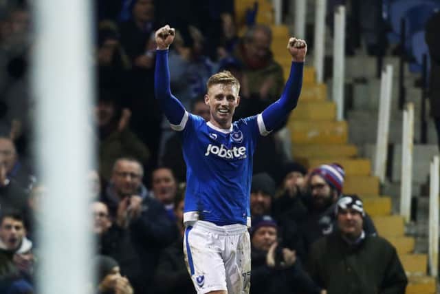 Eoin Doyle celebrates his first goal for new-club Pompey in last night's 2-0 Fratton Park win over Blackpool Picture: Joe Pepler