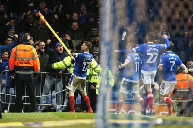 Eoin Doyle celebrates with the Pompey fans after sealing a 2-0 win over Blackpool last night Picture: Joe Pepler