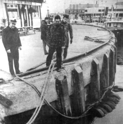 The diving team from HMS Vernon searching Portsmouths Camber Dock for the highly sophisticated diving equipment, stolen from a parked car in Southsea (6827-1)