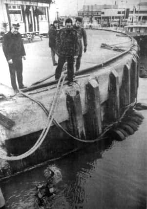 The diving team from HMS Vernon searching Portsmouths Camber Dock for the highly sophisticated diving equipment, stolen from a parked car in Southsea (6827-1)
