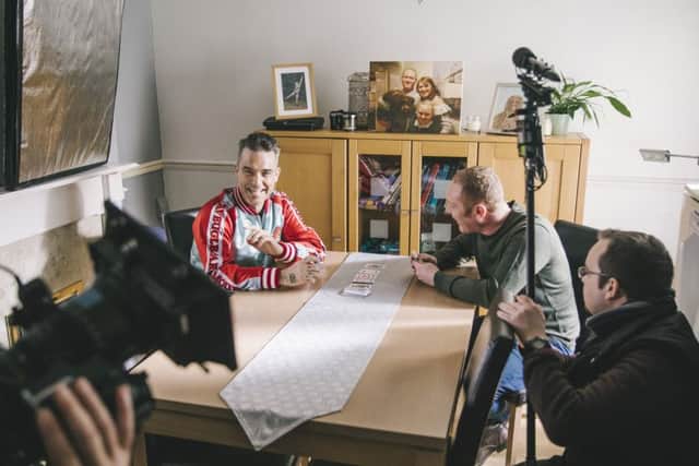 Robbie Williams talking to Mike Bingham at his Gosport home Picture: Andrew Whitton