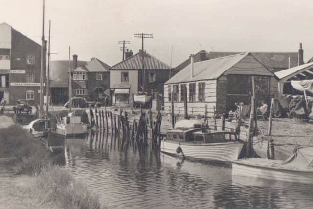 TIDAL A view up the creek at Emsworth looking towards Queen Street, circa 1950s		              Picture: Barry Cox Collection